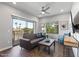 Inviting living room featuring modern decor, a ceiling fan, and a sliding glass door to the outside at 475 N 9Th St # 206, Phoenix, AZ 85006