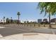 View of the neighborhood featuring palm trees and city buildings in the distance at 475 N 9Th St # 206, Phoenix, AZ 85006