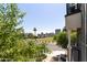 Neighborhood view from the balcony showing nearby cityscape and green space at 475 N 9Th St # 206, Phoenix, AZ 85006