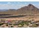 A desert landscape is shown surrounding homes in this aerial view at 5208 W Straight Arrow Ln, Phoenix, AZ 85083