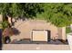 This aerial image showcases a charming backyard patio with ample seating, perfect for outdoor dining and entertaining guests at 5208 W Straight Arrow Ln, Phoenix, AZ 85083