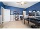 Bedroom featuring neutral carpeting, ceiling fan, shelving, and a large window at 5208 W Straight Arrow Ln, Phoenix, AZ 85083