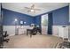 Spacious bedroom features neutral carpeting, ceiling fan, and a large window at 5208 W Straight Arrow Ln, Phoenix, AZ 85083