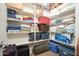 Spacious walk-in closet featuring shelving to store luggage, blankets, and various household items at 5208 W Straight Arrow Ln, Phoenix, AZ 85083