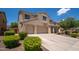 A lovely two-story home featuring a spacious three-car garage and well-maintained landscaping at 5208 W Straight Arrow Ln, Phoenix, AZ 85083