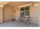 Inviting covered porch with seating area, decorative wreath, and view to the exterior at 5208 W Straight Arrow Ln, Phoenix, AZ 85083