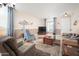 A cozy living room with warm tones, plush seating, and natural light, perfect for relaxation at 5208 W Straight Arrow Ln, Phoenix, AZ 85083