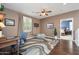 Study with wood floors, ceiling fan, and a desk with an open view to additional bedrooms at 5208 W Straight Arrow Ln, Phoenix, AZ 85083