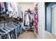 Organized walk-in closet featuring ample storage space and shelving for clothes and accessories at 5208 W Straight Arrow Ln, Phoenix, AZ 85083