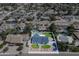 Wide aerial view of the property showing the landscaping, pool, and surrounding neighborhood at 5937 E Corrine Dr, Scottsdale, AZ 85254