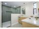 Modern bathroom features a walk-in shower, stylish fixtures, and elegant green and marble tile work at 5937 E Corrine Dr, Scottsdale, AZ 85254