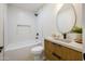 Stylish bathroom with modern vanity, sleek fixtures, and a shower-tub combo at 5937 E Corrine Dr, Scottsdale, AZ 85254