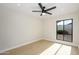 Bright bedroom with modern ceiling fan, recessed lights, and large window for plenty of natural light at 5937 E Corrine Dr, Scottsdale, AZ 85254