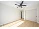 This bedroom features sleek ceiling fan, light hardwood floors, and sliding closet doors at 5937 E Corrine Dr, Scottsdale, AZ 85254