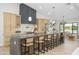Stunning kitchen with a large island, modern light fixtures, stainless steel appliances, and an open layout at 5937 E Corrine Dr, Scottsdale, AZ 85254
