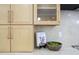 Close-up of kitchen cabinets and countertop with decorative items at 5937 E Corrine Dr, Scottsdale, AZ 85254