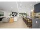 Bright, open living area with a large kitchen island and comfortable seating arrangements at 5937 E Corrine Dr, Scottsdale, AZ 85254