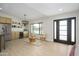Cozy living space with built-in bar, wine cooler, and modern lighting fixtures at 5937 E Corrine Dr, Scottsdale, AZ 85254