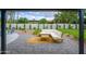View of a charming outdoor patio with gray pavers, a comfortable sectional, and a lush backyard at 5937 E Corrine Dr, Scottsdale, AZ 85254