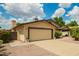 Charming single-story home featuring a two-car garage, desert landscaping, and a cozy entrance at 6420 W Beverly Ln, Glendale, AZ 85306