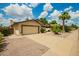 Charming single-story home featuring a two-car garage, desert landscaping, and a cozy entrance at 6420 W Beverly Ln, Glendale, AZ 85306