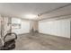 Spacious garage featuring ample built-in storage cabinets along the walls and epoxy flooring at 6420 W Beverly Ln, Glendale, AZ 85306