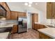 Kitchen boasts stainless steel appliances and ample oak cabinetry, offering practical storage and functionality at 6420 W Beverly Ln, Glendale, AZ 85306