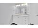 This bathroom has a vanity with a marble top and white cabinets at 6808 N 11Th St, Phoenix, AZ 85014