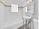 Clean and minimalistic white bathroom with tiled tub at 6808 N 11Th St, Phoenix, AZ 85014