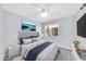 Inviting bedroom with soft lighting, a plush headboard, and a serene window view at 6808 N 11Th St, Phoenix, AZ 85014