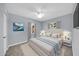 Well-lit bedroom with a full sized bed, soft carpet, neutral colors, and large windows offering natural light at 6808 N 11Th St, Phoenix, AZ 85014