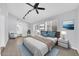 Comfortable bedroom boasts lots of light, neutral colors and a ceiling fan at 6808 N 11Th St, Phoenix, AZ 85014