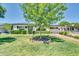 Desirable single-story house boasts a lush green lawn, mature trees, and a welcoming front entrance with excellent curb appeal at 6808 N 11Th St, Phoenix, AZ 85014