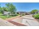 Attractive single-story home with well-manicured lawn, mature trees, a covered parking area, and inviting curb appeal at 6808 N 11Th St, Phoenix, AZ 85014