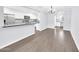 Modern kitchen boasts white cabinets, granite counters, tile backsplash, and stainless steel appliances at 6808 N 11Th St, Phoenix, AZ 85014