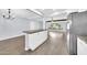 Kitchen with an island and stainless steel appliances opens to a large living room at 6808 N 11Th St, Phoenix, AZ 85014