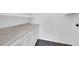 The laundry room features white cabinets and countertops with dark tile floors at 6808 N 11Th St, Phoenix, AZ 85014