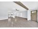 Open concept living area with kitchen access, hardwood floors, and abundant natural light at 6808 N 11Th St, Phoenix, AZ 85014