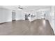Spacious living room featuring wood-look floors and a seamless transition to the kitchen at 6808 N 11Th St, Phoenix, AZ 85014