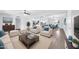 Bright living room featuring an open floor plan that leads to a well-equipped kitchen and dining area at 6808 N 11Th St, Phoenix, AZ 85014