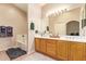 Bathroom with double sink vanity, a large mirror and soaking tub at 7031 S 32Nd Pl, Phoenix, AZ 85042