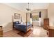 Bedroom with blue bedding, ceiling fan and lots of natural light from the large window at 7031 S 32Nd Pl, Phoenix, AZ 85042