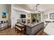Inviting living room boasts modern furnishings, a cozy fireplace, and sliding door access to the backyard at 7031 S 32Nd Pl, Phoenix, AZ 85042