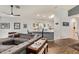 Open concept living room boasts modern furnishings and seamless flow to kitchen at 7031 S 32Nd Pl, Phoenix, AZ 85042