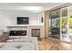 Bright, open-concept space with cozy fireplace and seamless flow to the patio at 7031 S 32Nd Pl, Phoenix, AZ 85042