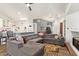 Bright, open-concept space with a cozy living area, fireplace, and seamless flow to kitchen at 7031 S 32Nd Pl, Phoenix, AZ 85042