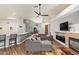 Bright, open-concept space with a cozy living area, fireplace, and seamless flow to kitchen at 7031 S 32Nd Pl, Phoenix, AZ 85042