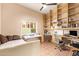 Office/flex space with desk, daybed, built-in shelving and great natural light at 7031 S 32Nd Pl, Phoenix, AZ 85042