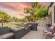 Outdoor kitchen and bar with sink and grill overlooks the greenbelt beyond the fenced yard at 7031 S 32Nd Pl, Phoenix, AZ 85042
