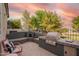 Outdoor kitchen and bar with pizza oven, grill, sink and stainless steel appliances overlook the backyard at 7031 S 32Nd Pl, Phoenix, AZ 85042